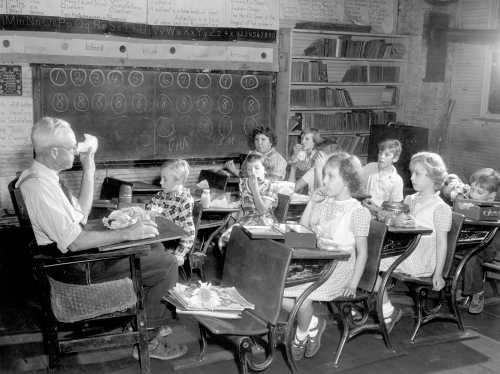 Historic Photograph of One-Room Schoolhouse Highlights Educational Heritage and Artistic Legacy