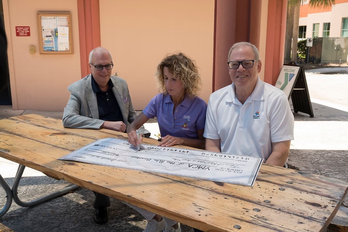 Community Honors Kyrie Larry with Grant to YMCA for Water Safety